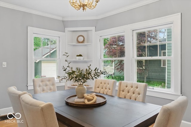 140 E 44th St, Indianapolis, IN 46205 - dining area featuring crown molding, an inviting chandelier, built in features, and baseboards