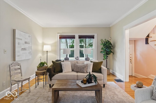 140 E 44th St, Indianapolis, IN 46205 - living area featuring wood finished floors, crown molding, visible vents, and baseboards