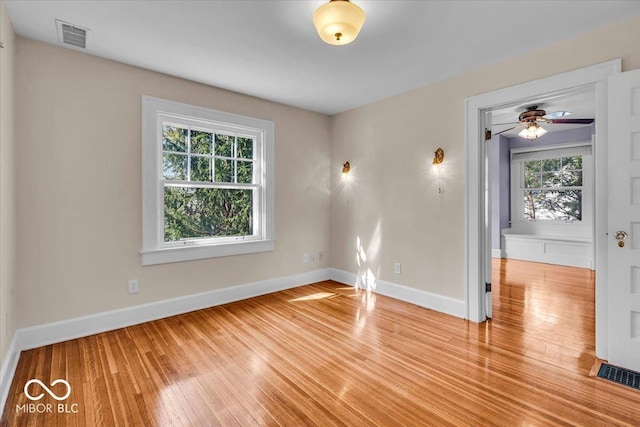 140 E 44th St, Indianapolis, IN 46205 - spare room featuring light wood finished floors, visible vents, ceiling fan, and baseboards