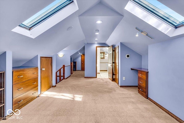 140 E 44th St, Indianapolis, IN 46205 - bonus room with baseboards, carpet floors, and lofted ceiling with skylight