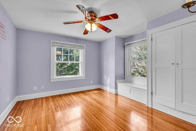 140 E 44th St, Indianapolis, IN 46205 - spare room with light wood-style floors, plenty of natural light, a ceiling fan, and baseboards
