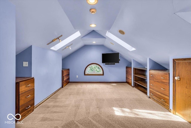 140 E 44th St, Indianapolis, IN 46205 - additional living space with lofted ceiling with skylight, carpet flooring, and baseboards
