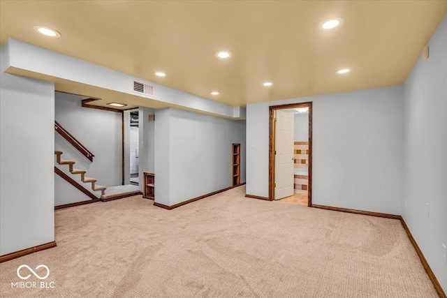 140 E 44th St, Indianapolis, IN 46205 - finished below grade area with carpet flooring, visible vents, baseboards, recessed lighting, and stairs