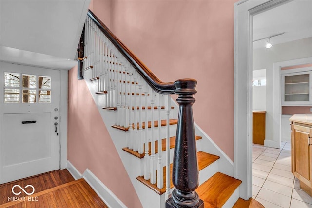 140 E 44th St, Indianapolis, IN 46205 - stairs featuring baseboards and tile patterned flooring