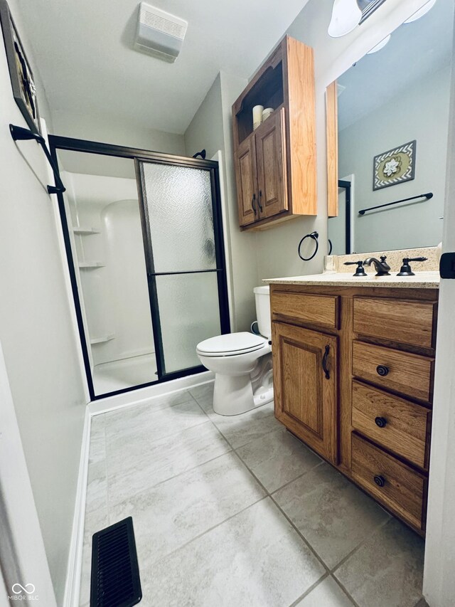 full bath with vanity, toilet, and a stall shower