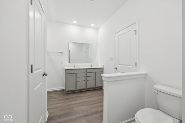10126 Camp Creek Way, Indianapolis, IN 46229 - bathroom with double vanity, wood finished floors, and recessed lighting