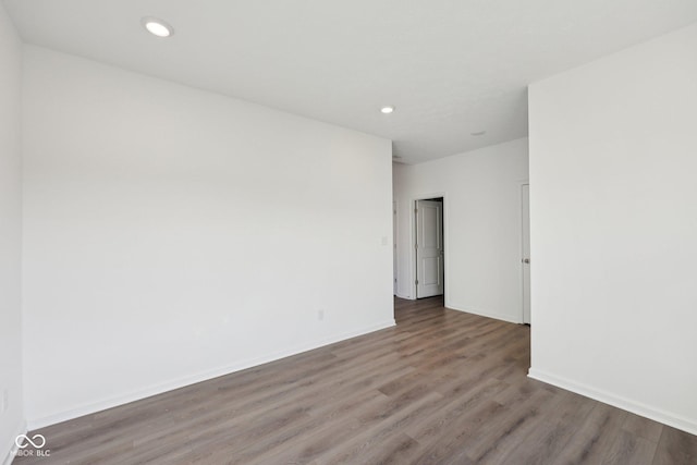 10126 Camp Creek Way, Indianapolis, IN 46229 - empty room featuring wood finished floors and recessed lighting