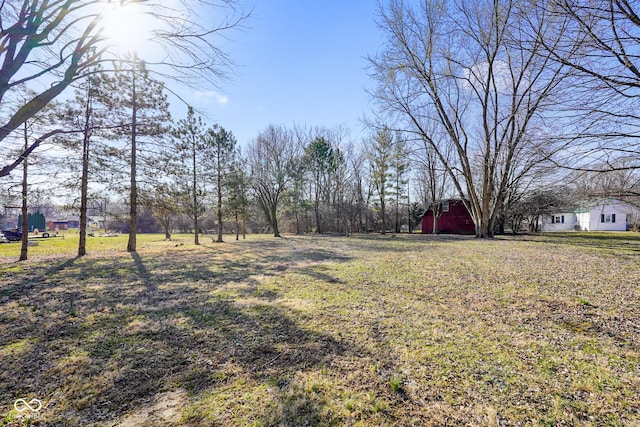 view of yard featuring a barn and an outdoor structure