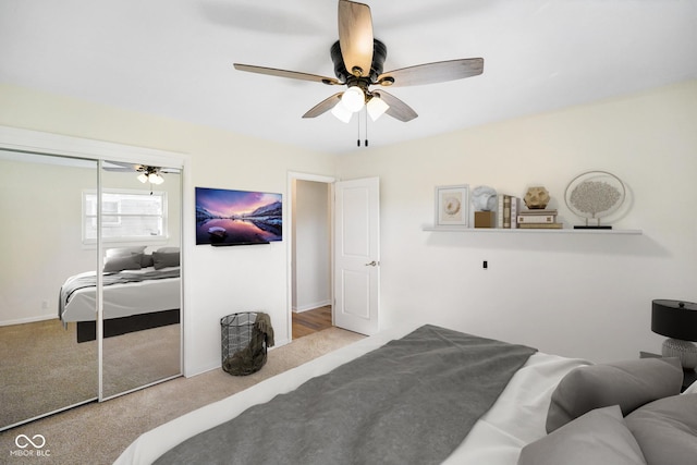 carpeted bedroom with a closet and ceiling fan