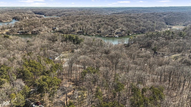 aerial view with a wooded view and a water view