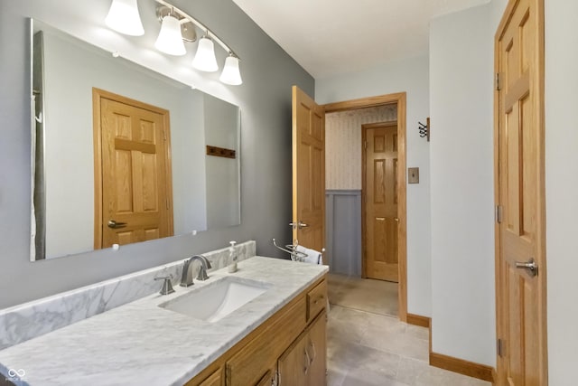 bathroom featuring vanity and baseboards