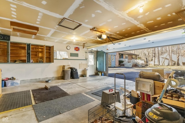 miscellaneous room featuring a garage and concrete flooring