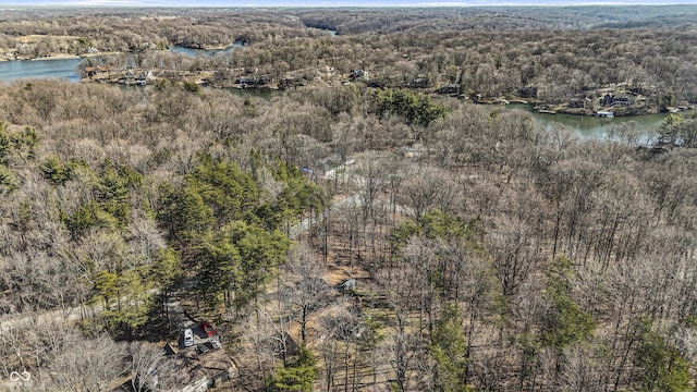 aerial view featuring a view of trees and a water view