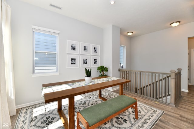 office featuring visible vents, baseboards, and light wood-style floors