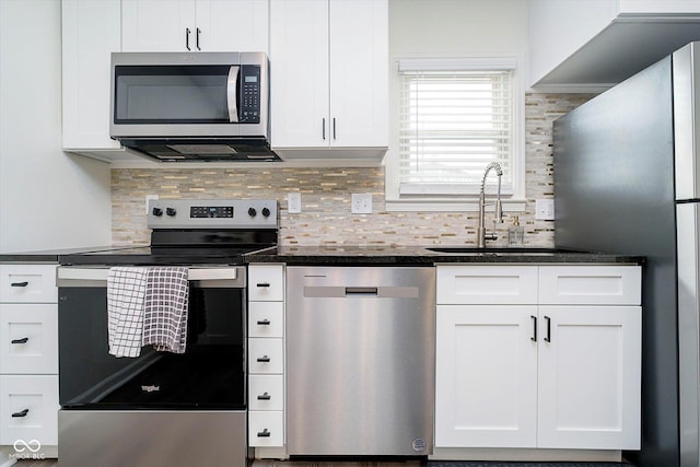 kitchen featuring a sink, appliances with stainless steel finishes, and white cabinets