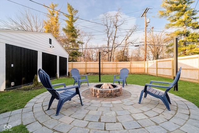 view of patio / terrace featuring an outdoor fire pit and a fenced backyard