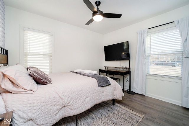 bedroom with wood finished floors, baseboards, and ceiling fan