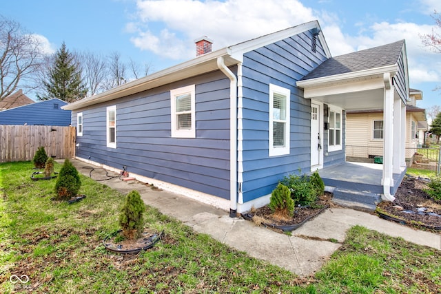 301 Villa Ave, Indianapolis, IN 46201 - view of property exterior with a chimney and fence