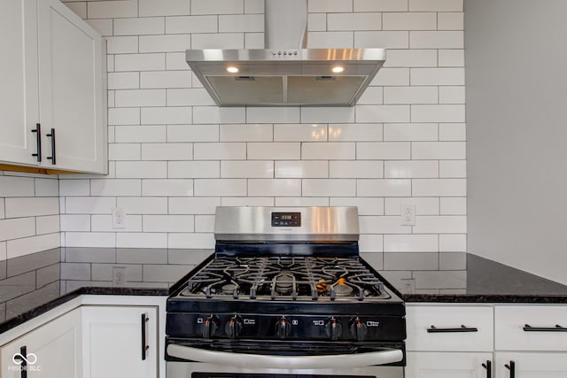 301 Villa Ave, Indianapolis, IN 46201 - kitchen with decorative backsplash, gas range, white cabinetry, and wall chimney range hood