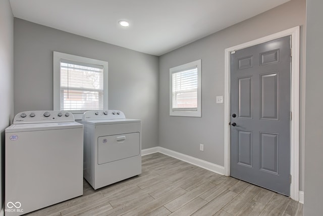 301 Villa Ave, Indianapolis, IN 46201 - clothes washing area with baseboards, separate washer and dryer, laundry area, and light wood finished floors