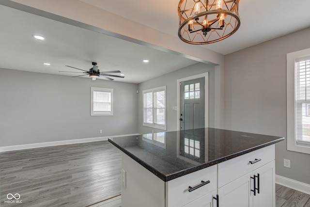 301 Villa Ave, Indianapolis, IN 46201 - kitchen featuring recessed lighting, baseboards, plenty of natural light, and wood finished floors