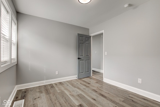 301 Villa Ave, Indianapolis, IN 46201 - spare room with wood finished floors, visible vents, and baseboards