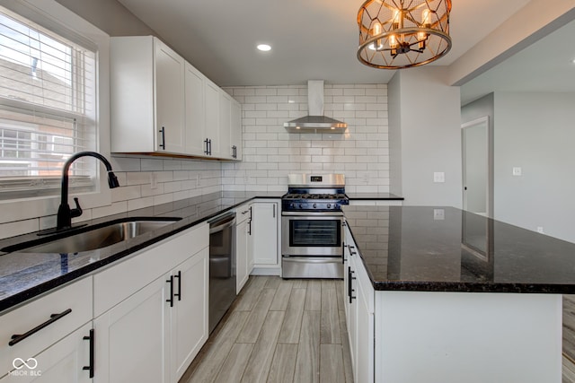 301 Villa Ave, Indianapolis, IN 46201 - kitchen with stainless steel gas range oven, wall chimney range hood, dishwasher, decorative backsplash, and a sink