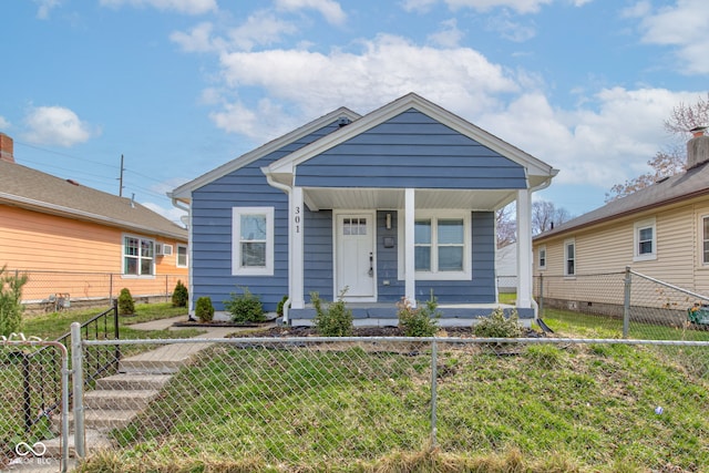 301 Villa Ave, Indianapolis, IN 46201 - view of front of home with a porch, a gate, a front yard, and a fenced front yard