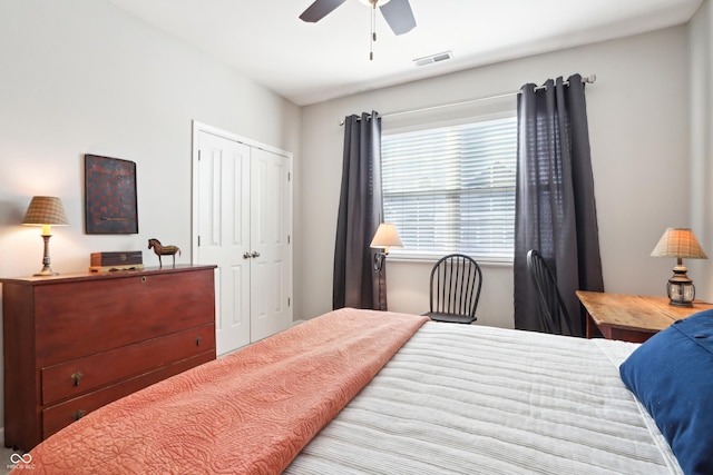 bedroom featuring visible vents, a closet, and ceiling fan