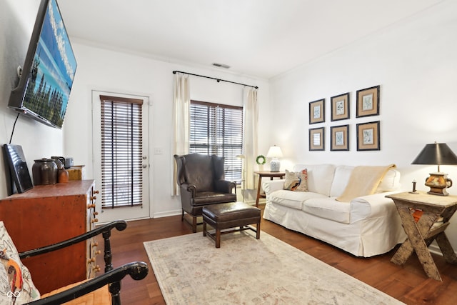 living room with visible vents and wood finished floors