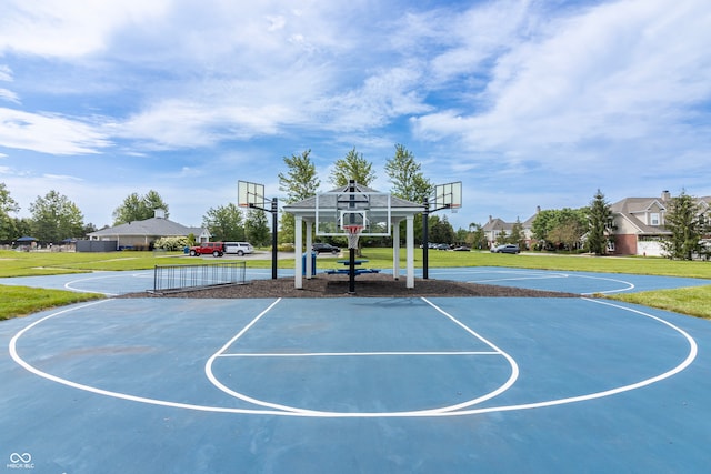 view of basketball court featuring community basketball court and a yard