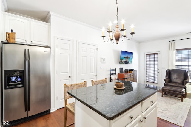 kitchen featuring crown molding, stainless steel fridge with ice dispenser, an inviting chandelier, dark wood-style floors, and white cabinetry