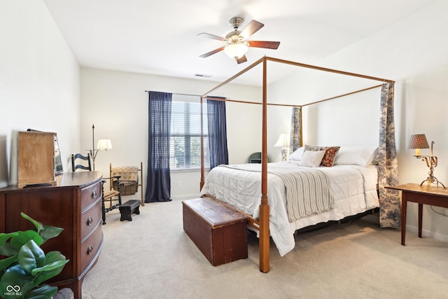 bedroom with visible vents, light carpet, baseboards, and ceiling fan