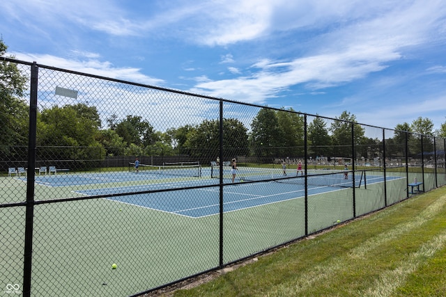 view of sport court with fence