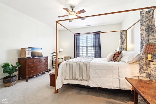 bedroom with visible vents, ceiling fan, and carpet