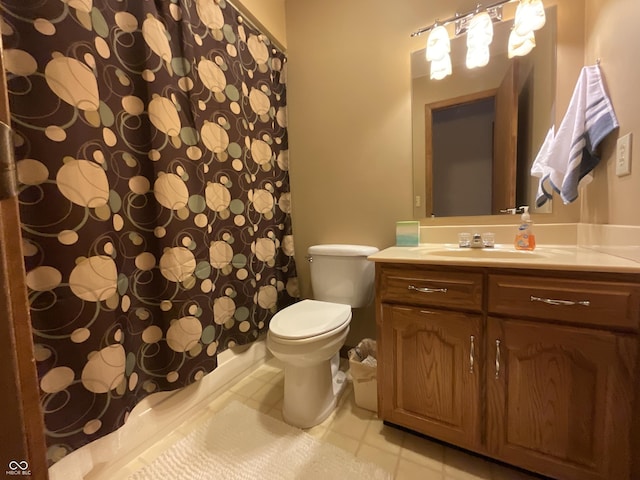 full bathroom with toilet, vanity, and a shower with curtain