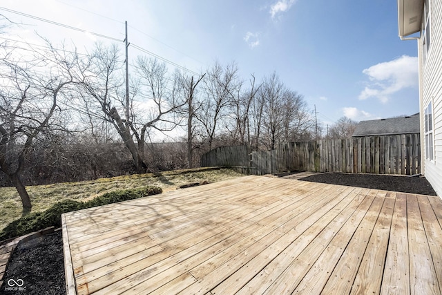 wooden terrace featuring fence