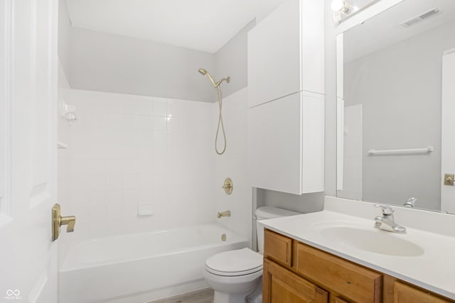 bathroom featuring vanity, toilet, bathtub / shower combination, and visible vents