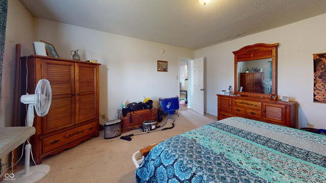 7853 Wildwood Farms Ln, Indianapolis, IN 46239 - carpeted bedroom with a textured ceiling
