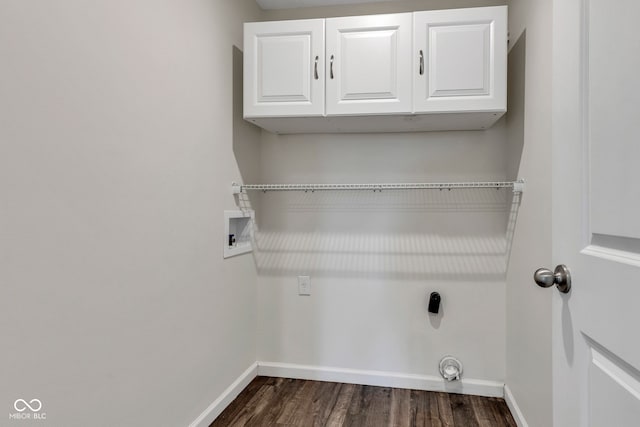 laundry area with dark wood-style flooring, cabinet space, baseboards, and washer hookup