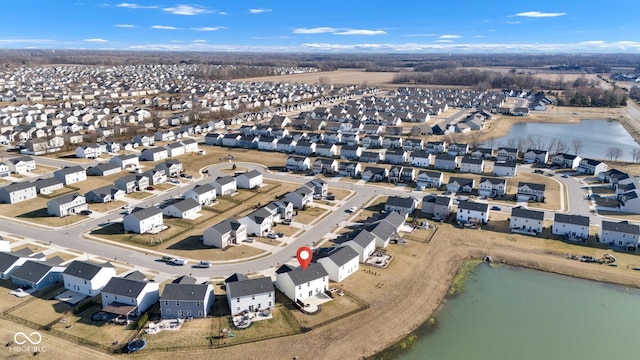 bird's eye view with a residential view and a water view