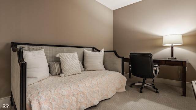 bedroom with lofted ceiling, baseboards, and carpet floors