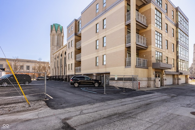 view of property featuring uncovered parking