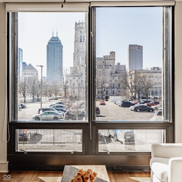 details with a view of city, parking, and wood finished floors