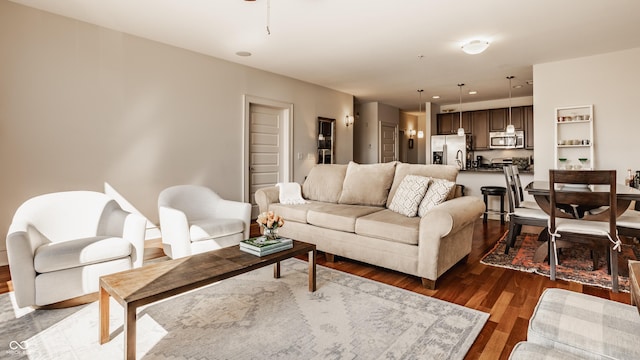 living room featuring recessed lighting and dark wood-style flooring