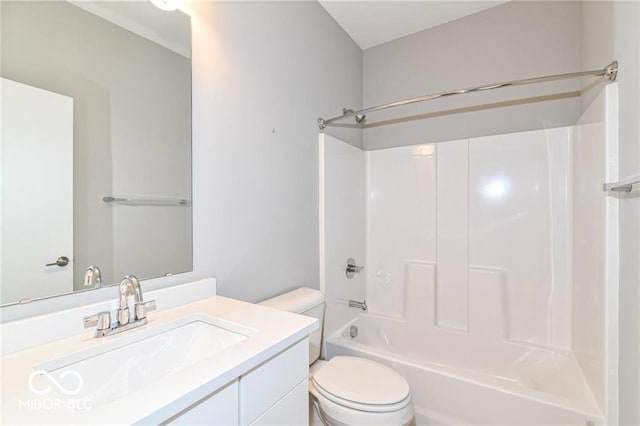 bathroom with shower / bathing tub combination, toilet, and vanity