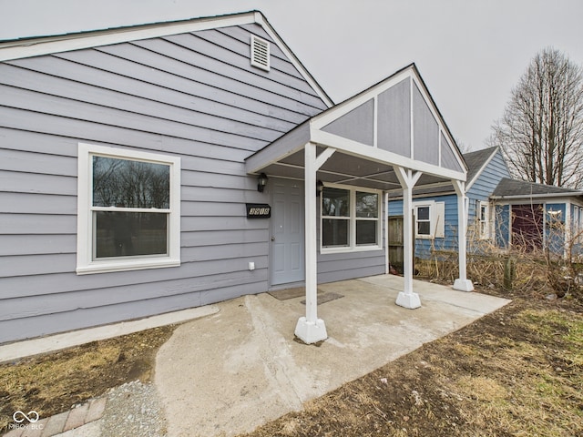 property entrance with a patio