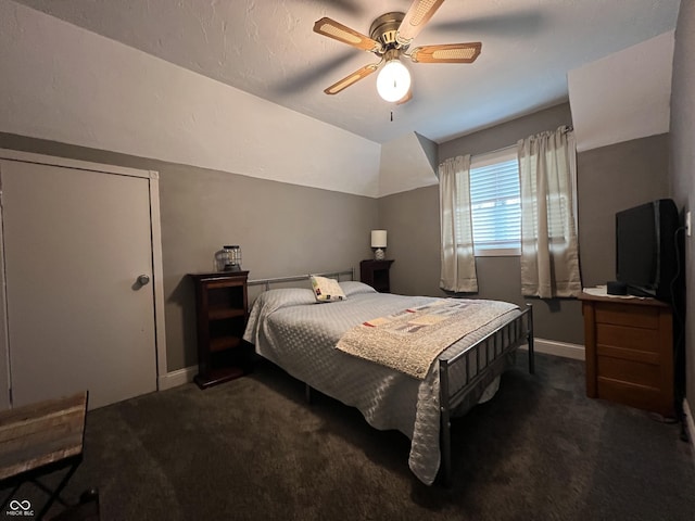 carpeted bedroom with baseboards, lofted ceiling, and ceiling fan