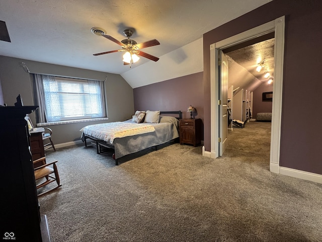 carpeted bedroom with a ceiling fan, lofted ceiling, and baseboards