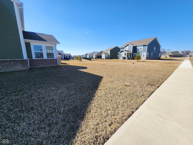 view of yard featuring a residential view